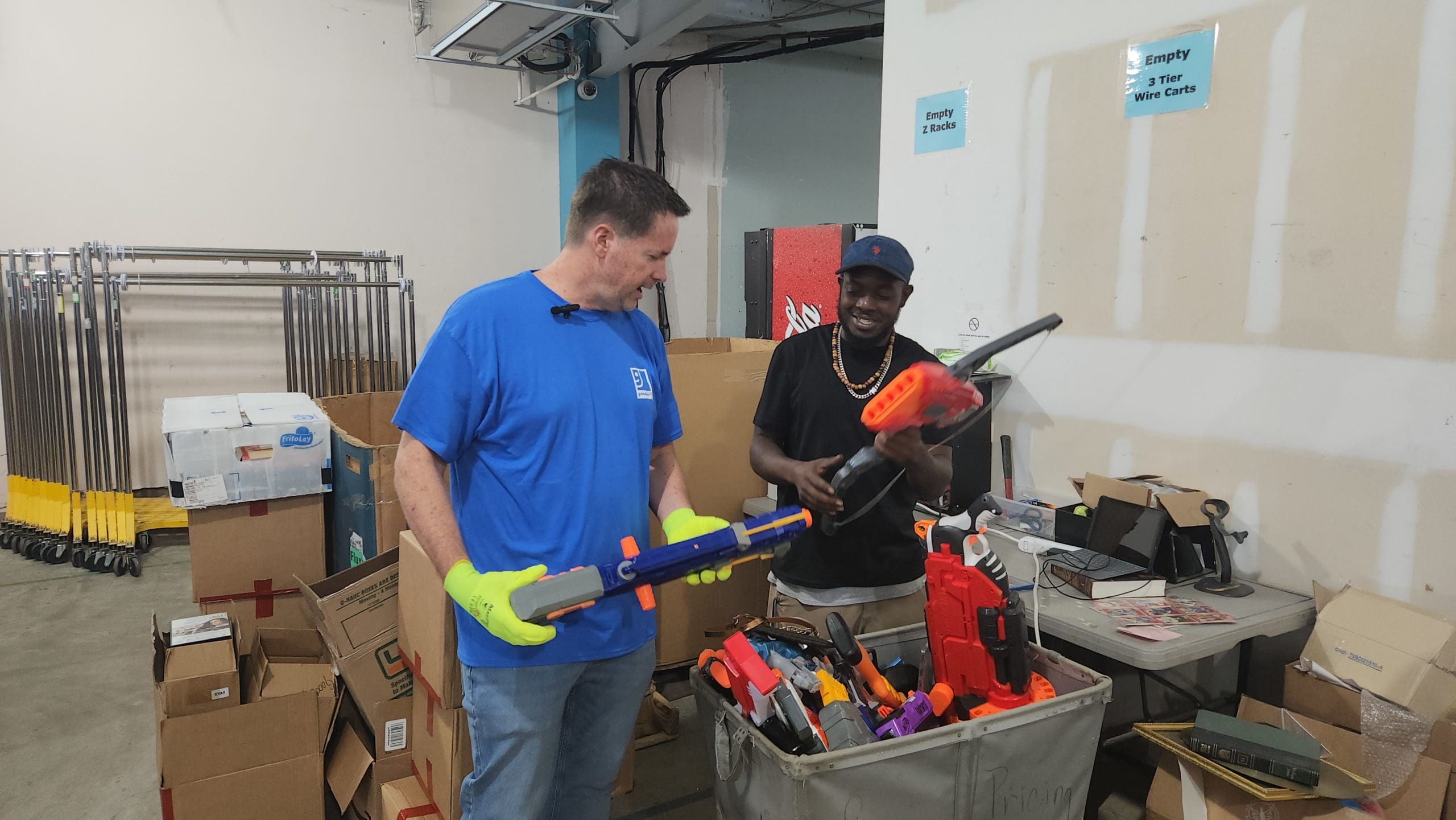 Todd and Robert looking at Nerf items priced for E-Commerce