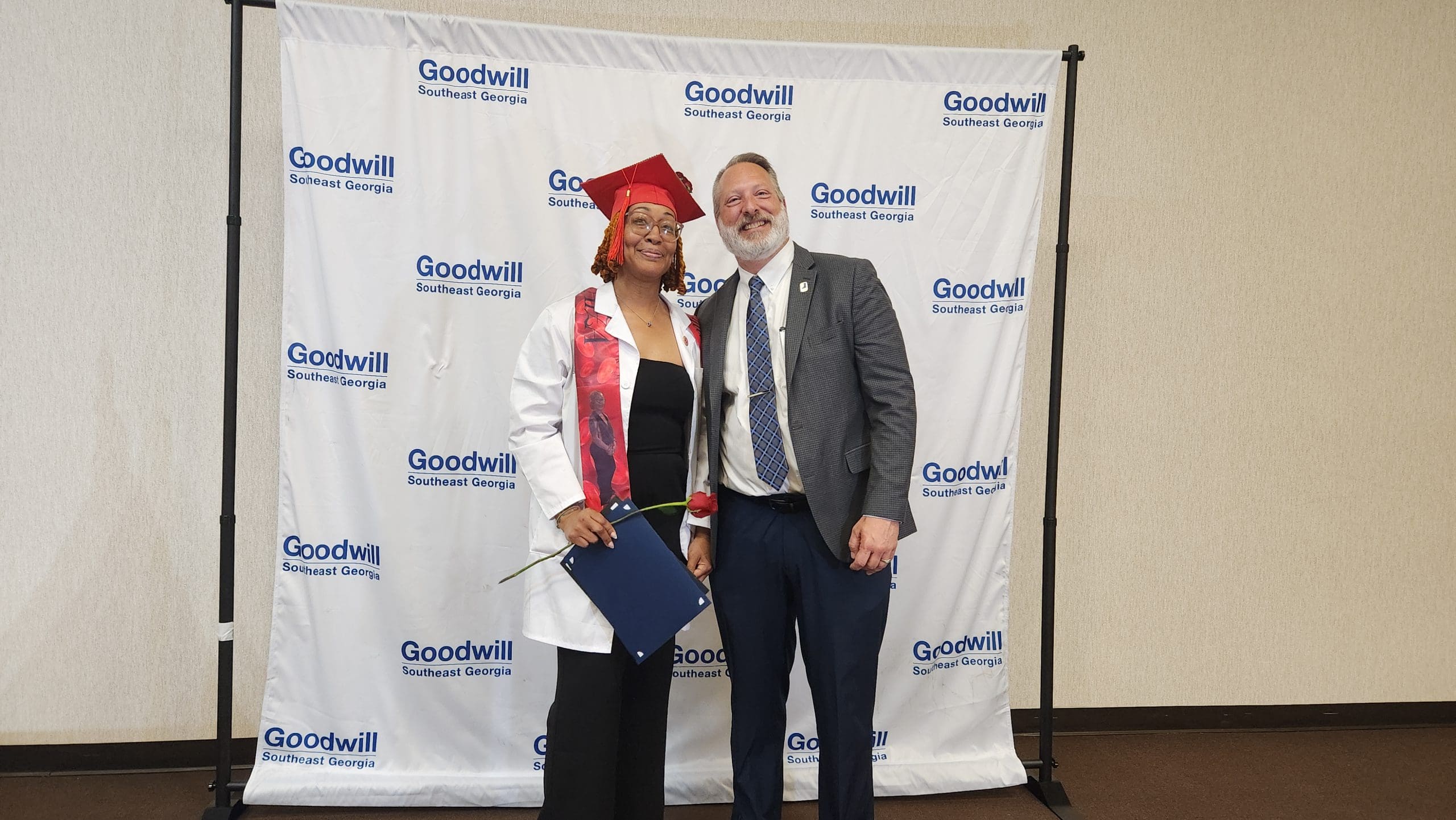Taiza Campbell, Phlebotomy cohort graduate, with Jason Marshall, President & CEO of Goodwill Southeast Georgia, after receiving her certification. 