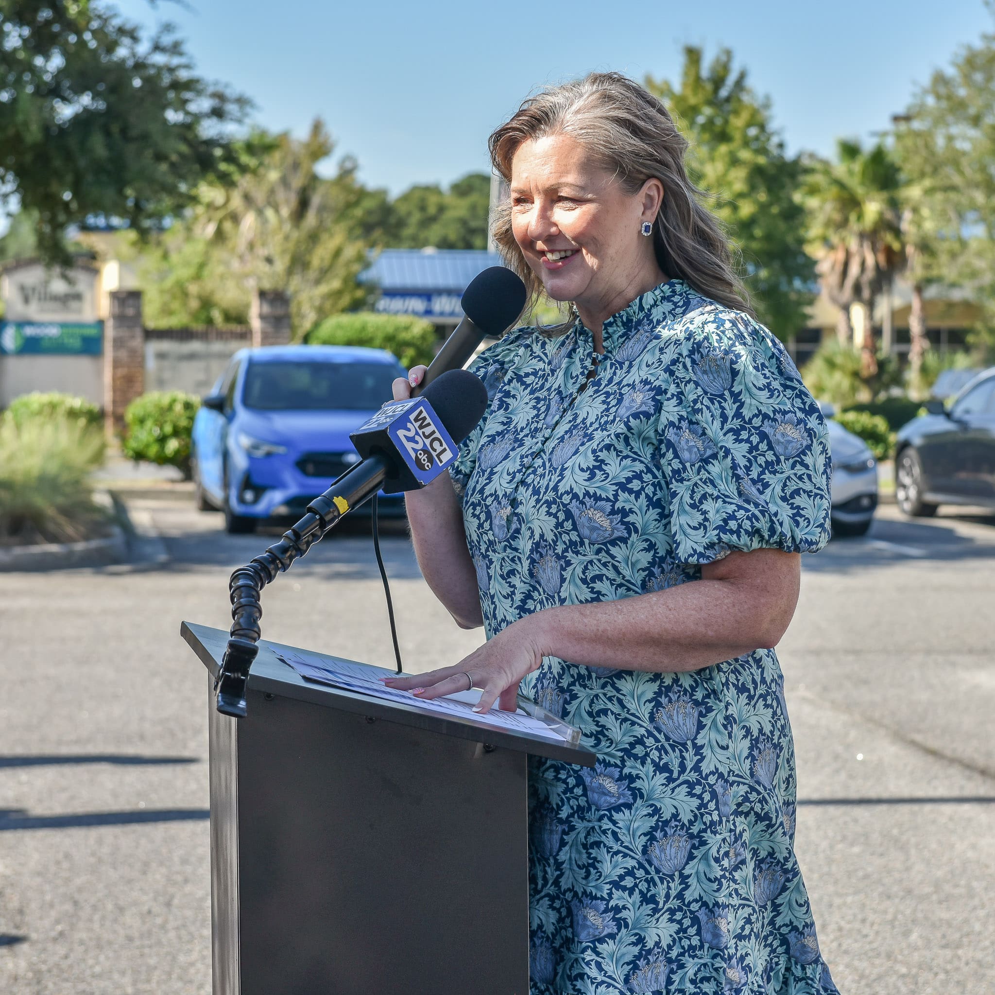 Holly Schor, Chief Mission Officer at Goodwill Southeast Georgia, speaks at the opening ceremony prior to the Pooler laptop distribution event. 