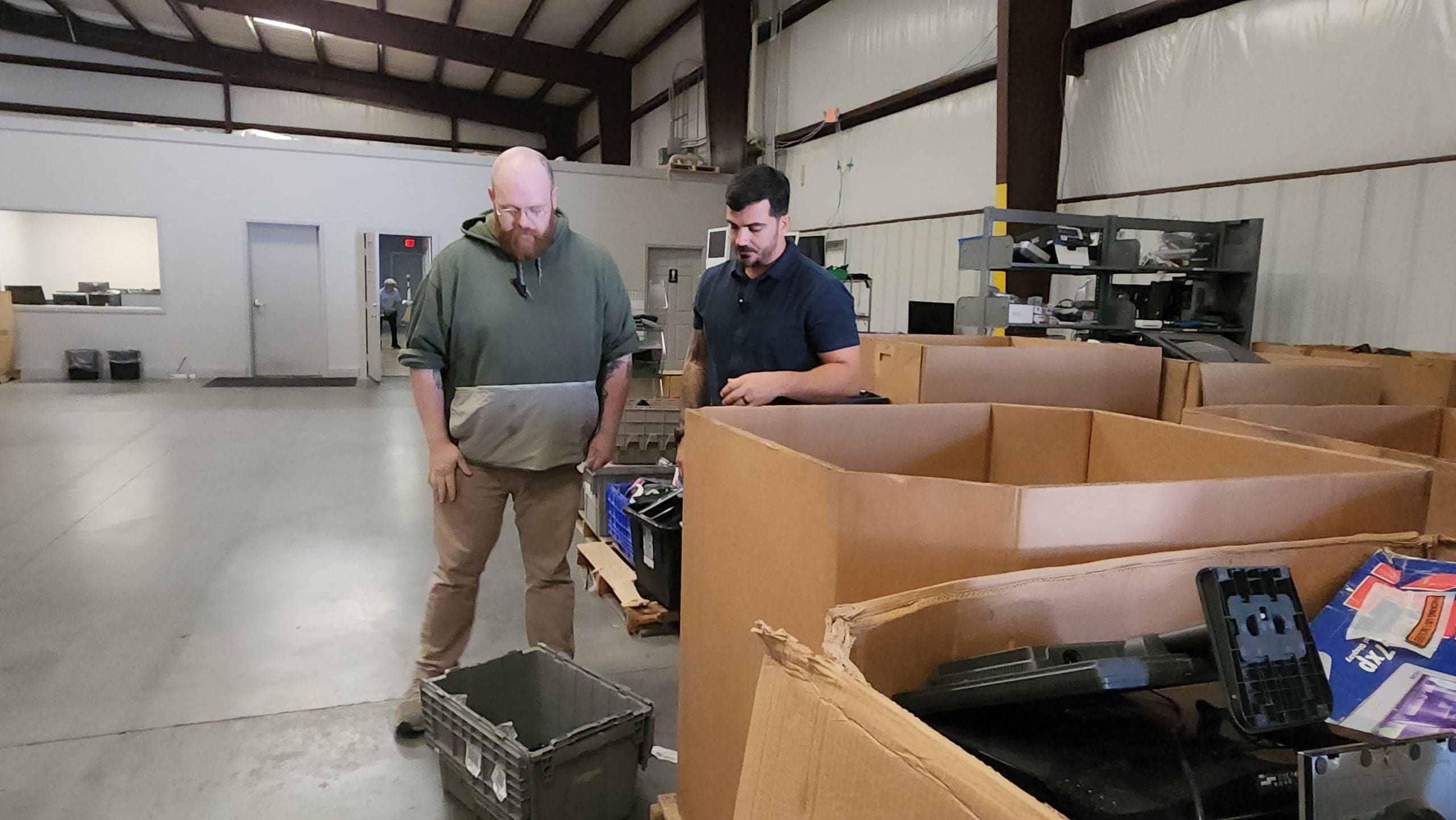 Goodwill Southeast Georgia Associates sort electronics for recycling.