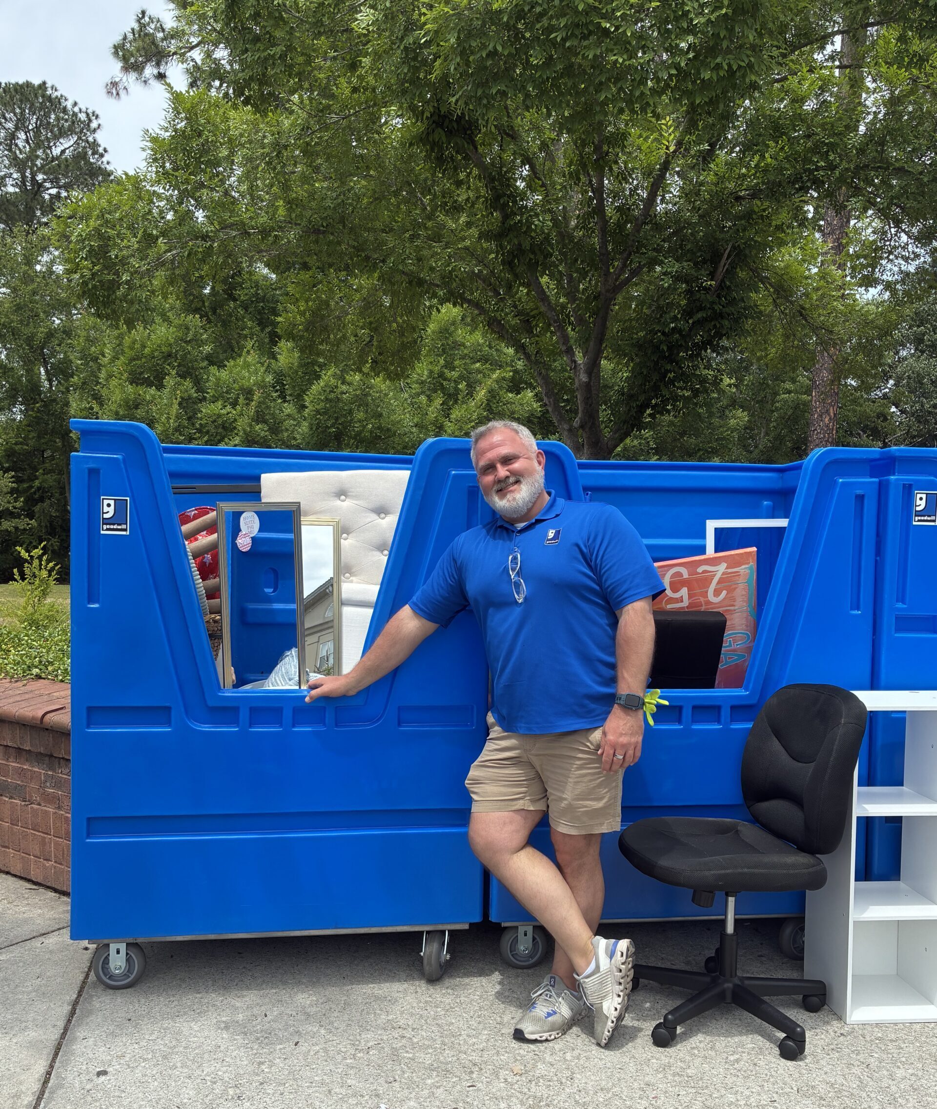 Man in front of donated goods