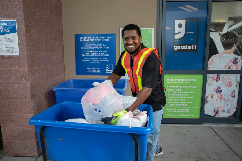 Goodwill employee handling donations