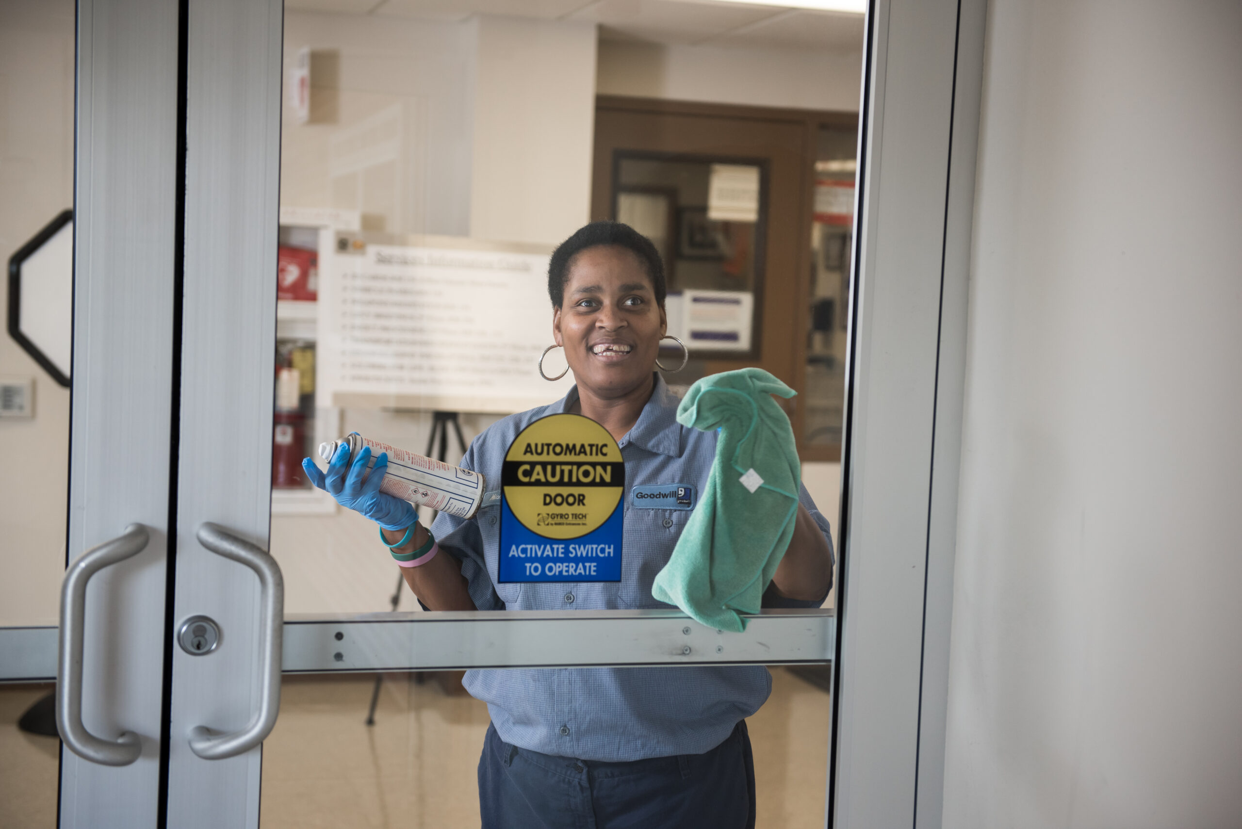 Woman cleaning door