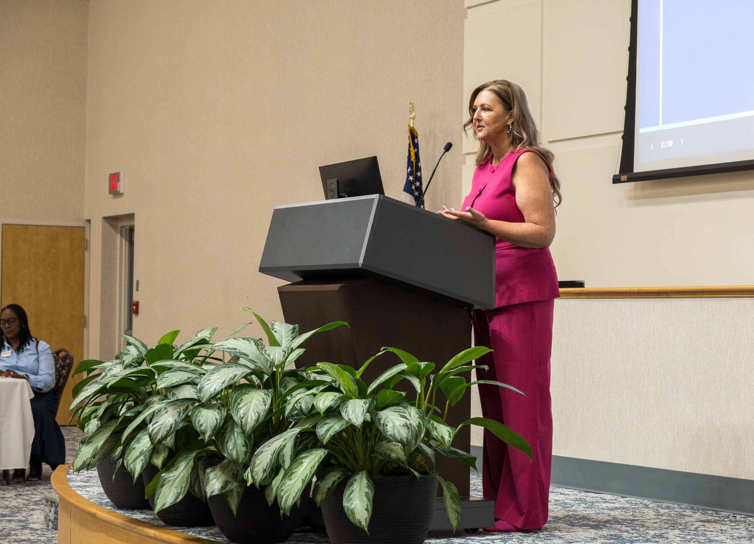 Holly Schor, Chief Mission Officer at Goodwill Southeast Georgia, addresses career credentialing program graduates on Friday, August 28 at Savannah Tech's Eckburg Auditorium.